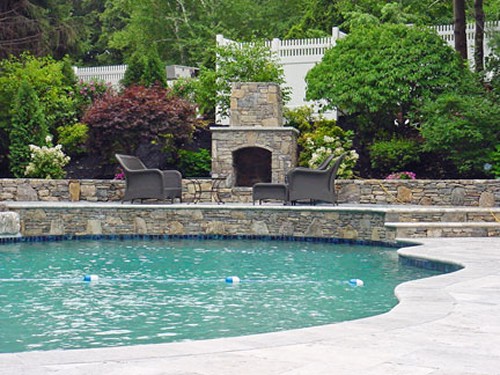 Free Form Pool, Elevated Fieldstone and Travertine Patio with Pool Side Fireplace by New View