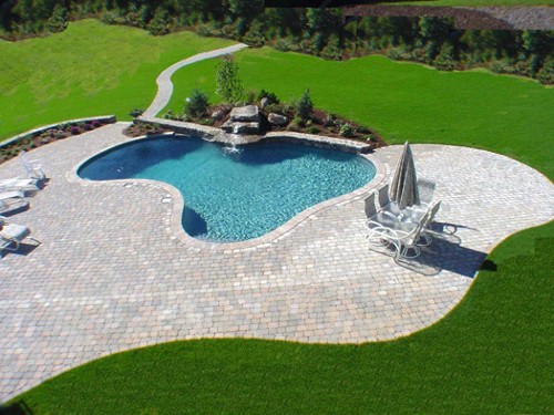 Free Form Pool with Waterfall, Sitting Wall and Paver Deck