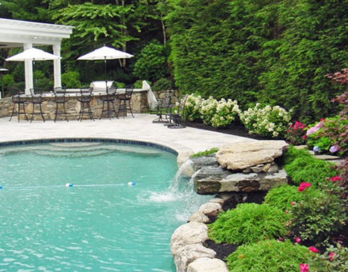Pool with Waterfall and Stone Bar by New View