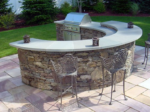 Curved Bi Level Bar with Blue Stone Top and Built in Grill by New View