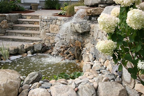 Natural Pond with Waterfall and Stone Steps to Fire Pit