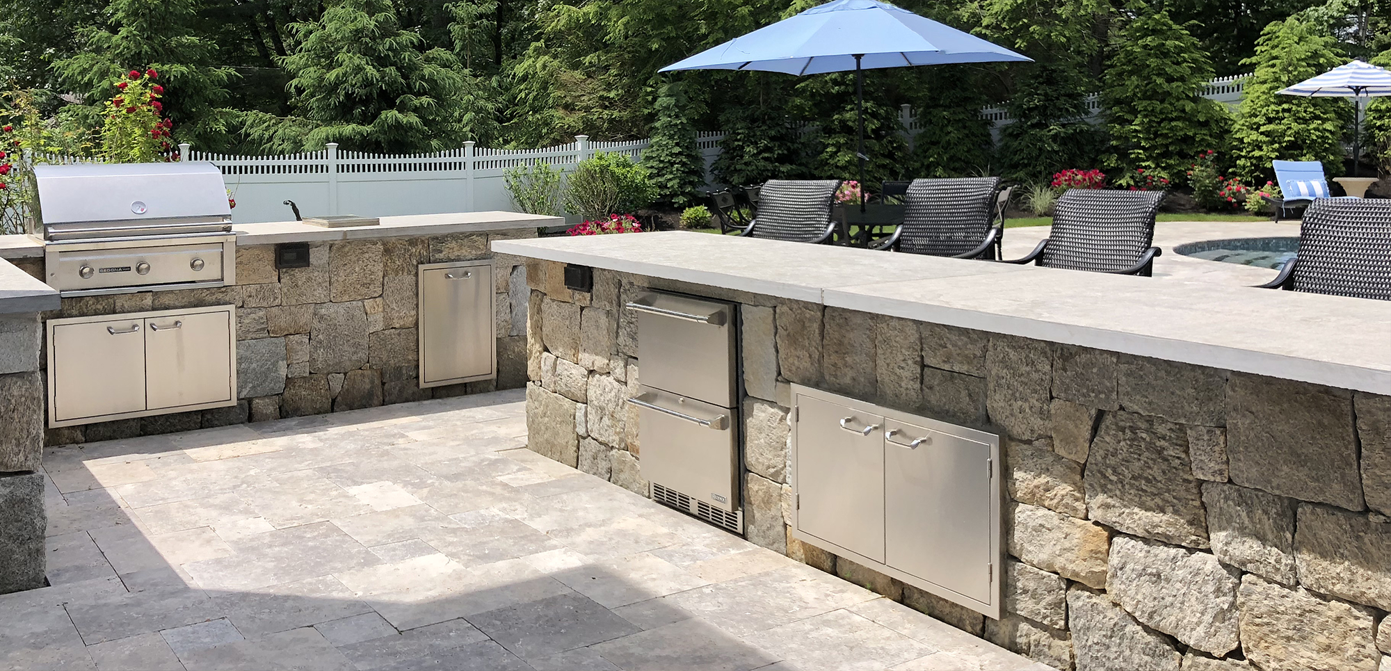 Patio,Landscaping, Stone Bars complete with Grill, Refrigerator drawers & Trash center by New View, Inc.