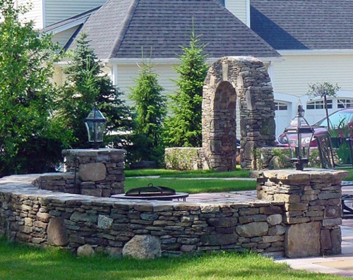 Stone Sitting Walls with Light Posts& Stone Arch by New View