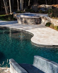 Fieldstone and Travertine Spa with Travertine Deck and Free Form Pool with Slide by New View