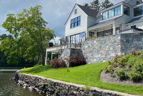 Multi-Level Travertine Patio with Retaining Walls and Steps by New View
