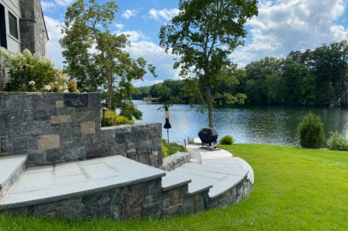 Curved steps with retaining wall by New View