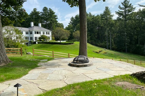 Natural flag stone patio, fire pit and retaining wall by New View