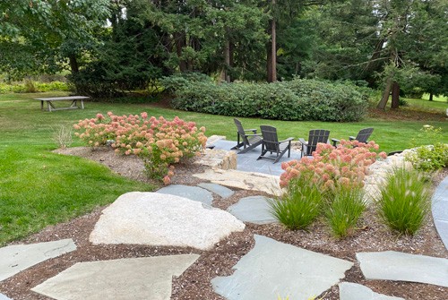 Natural bluestone flagging walkway to lower patio by New View
